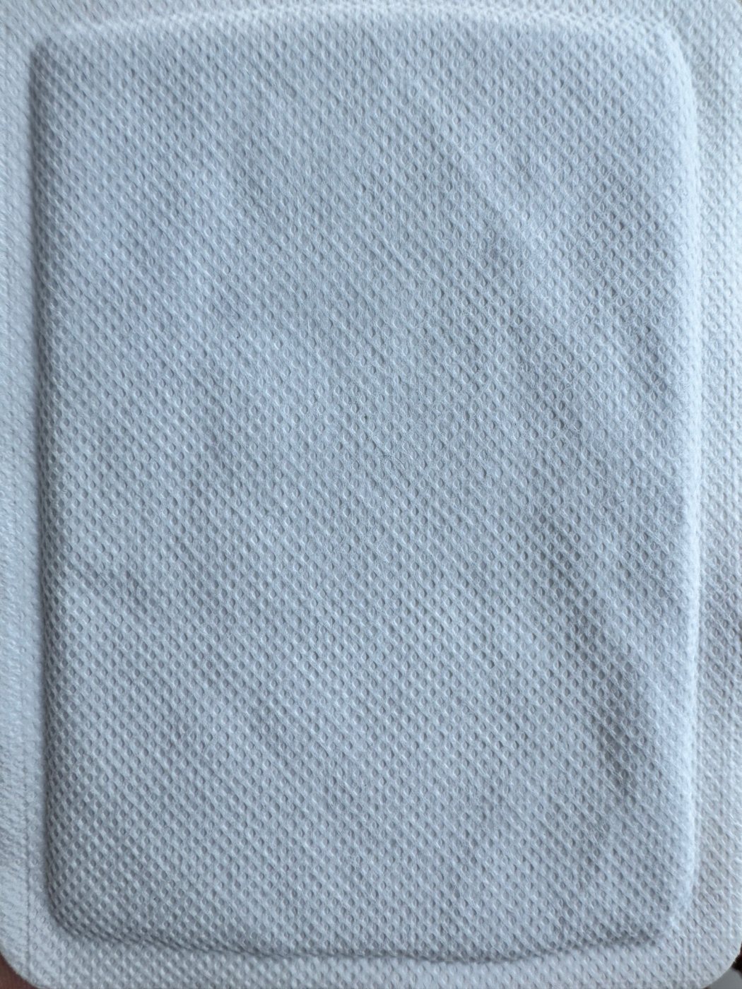 Nonwoven surface of disposable body warmer